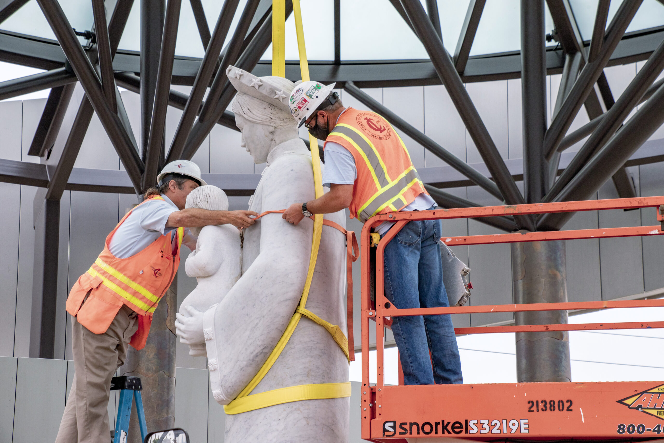 Construction workers gingerly move the Our Lady of La Vang statue closer to her pedestal. Photo courtesy Diocese of Orange. Note: Photo taken during construction.